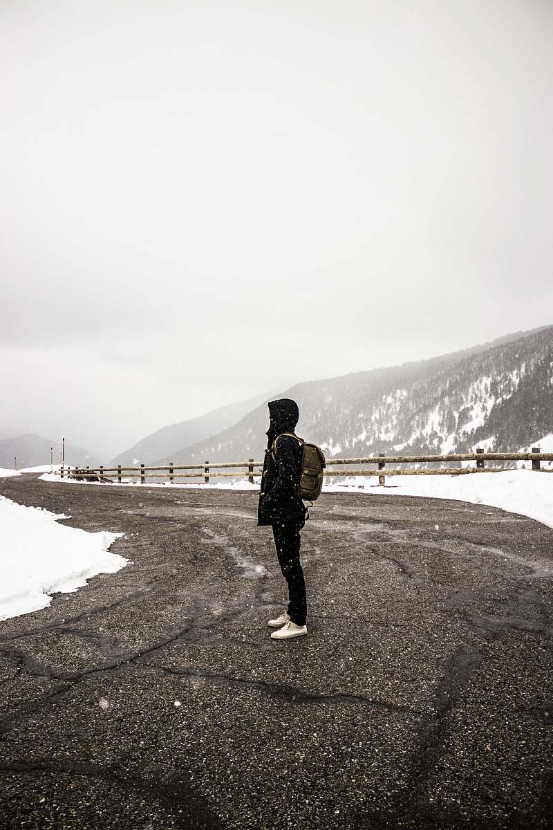 andorra la vella person standing on gray concrete top road near snow andorra